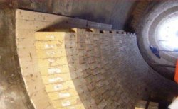 Figure 3: Installation of the insulation board across the shell bottom half.