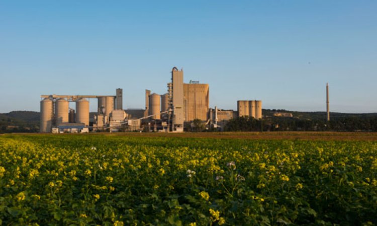 View of the Mannersdorf cement plant across neighbouring fields.