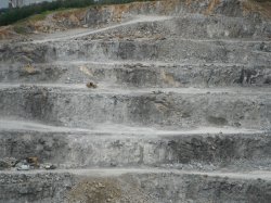 A loader makes its way up the face of the quarry at the Norcem Kjopsvik plan in Norway.