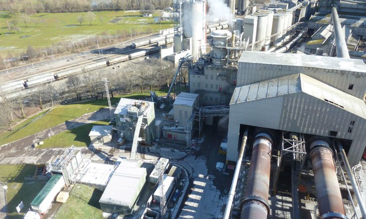 Looking down on a range of alternative fuel feeding equipment and expanded rail infrastructure from the pre-heater tower.