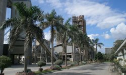 Perfectly-maintained gardens in front of silos and pre-heater tower at Negeri Sembilan Cement Industries Sdn Bhd plant in Bahau, Negeri Sembilan.
