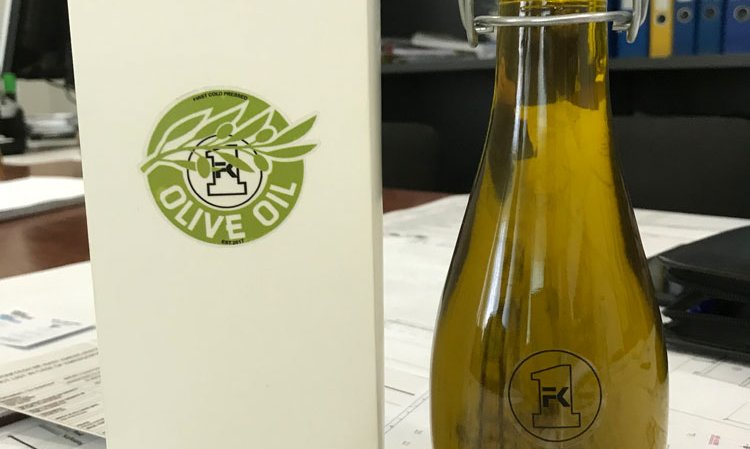 A bottle of Fushë Krujë Cement Factory’s own olive oil, made from olive trees planted around the site.
