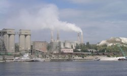 Dust pours out of an older Russian cement plant prior to the installation of filter bags.
