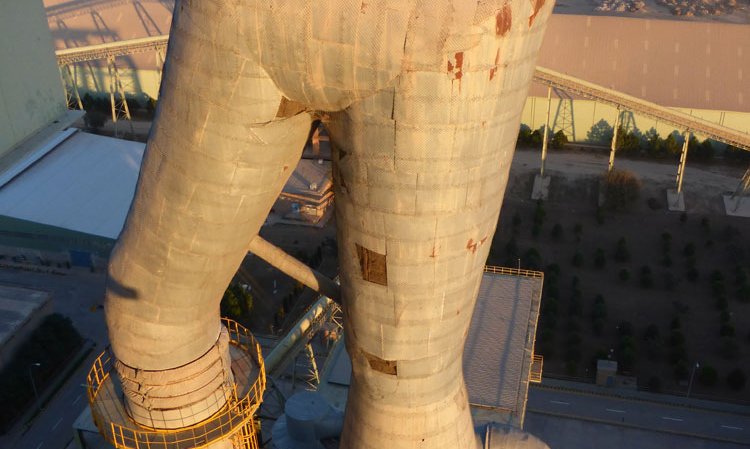 The goose-neck at the top of the precalciner, with the fields of the local farmers and other local cement plants in the distance.