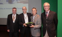 Yushiro Kihara (third from right) accepts an award from Votorantim Director Edvaldo Araujo Rabello.