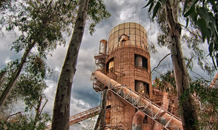 The dopol (pre-heater) of kiln No 2 at the Titan Depano Achaias plant in Greece, viewed through nearby tree. Source: Paul Touliatos, Titan Cement Co, entrant to the Global Cement Photography Competition.