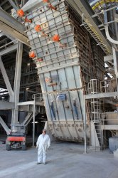 FLS ET 450x400 dryer-crusher, with worker for scale. Note air-cannons to ensure trouble-free operation.