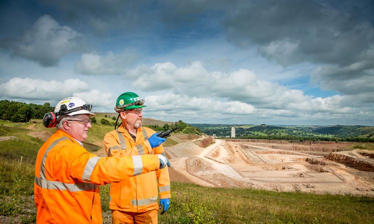 Experts from the plant survey part of the limestone quarry, with the plant’s preheater tower seen in the far background.
