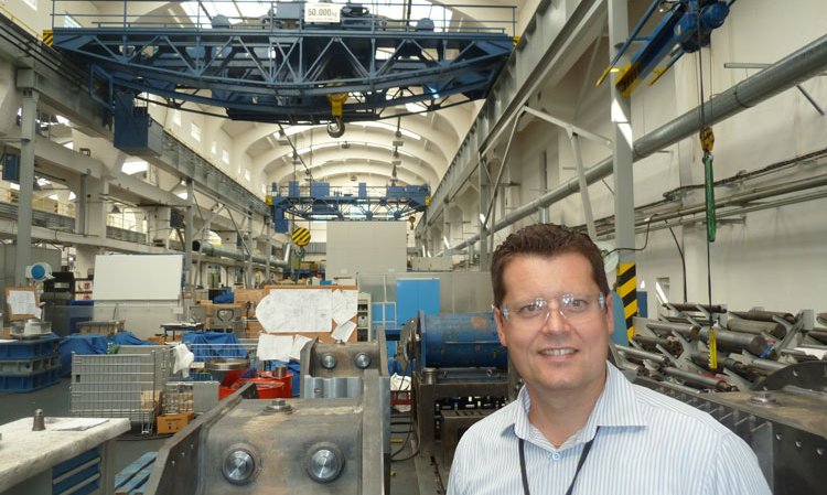 Tomas Zrostlik, managing director of Wikov Gear, in the assembly area. Note the designs in the background that the staff use to assemble the gearboxes by hand.