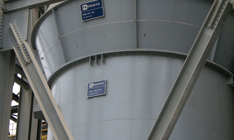 There are six vertical roller mills at the Ste. Genevieve plant - two raw material mills and four finish mills. There are approximately 10 vertical roller mills presently used for cement grinding in the US. The image shows an FLSmidth Atox Mill vertical roller mill for raw material grinding.