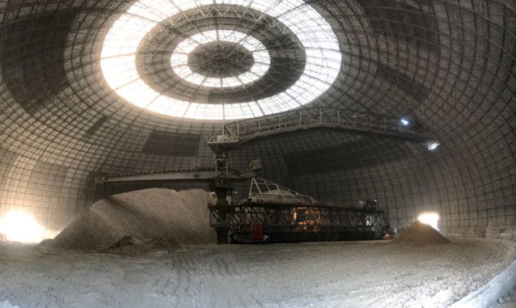 The scene inside Fushë Krujë Cement Factory’s 40,000t storage hall for raw materials, in the largest dome in the Balkans. Both the dome and the stacker/reclaimer were designed and supplied by Tangshan CBMI Engineering Design and Consultation Co., Ltd.