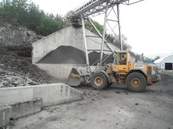 A wheeled loader delivers processed tyres to a fuel feeding station. (Point 21 on the plant schematic). Much of the plant infrastructure is cramped due to the proximity of the Tysfjord, village and mountains.