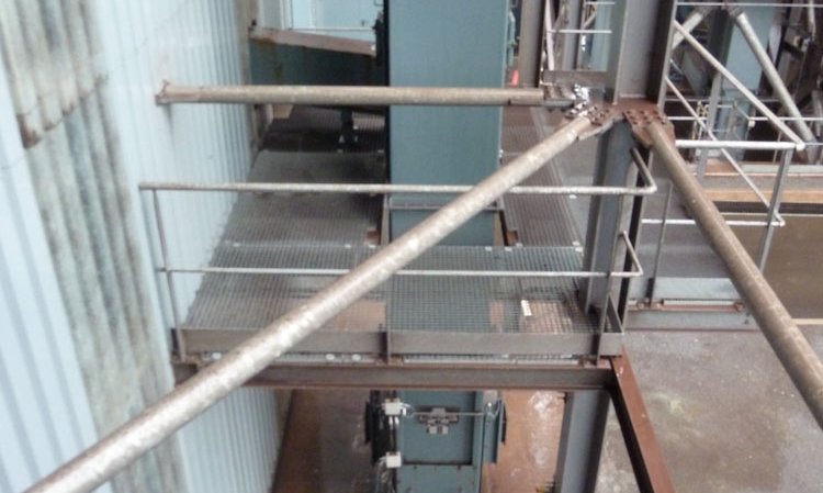 An AUMUND bucket elevator transfers ground slag from the mill to the top of the silos.