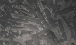 Figure 1: Optical microscopic observations of steel slag. a. Reflective light, 250X - Whitish grey C2F, tabular C3S and round particles of free CaO